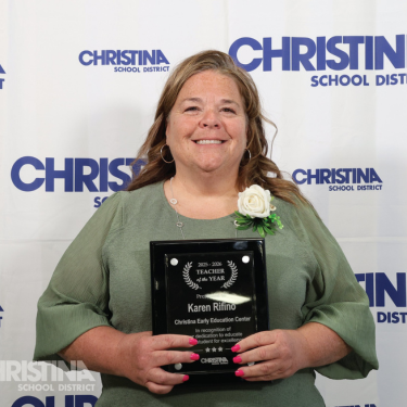 Photo of Karen Rifino Christina Early Education Center Teacher of the Year with award